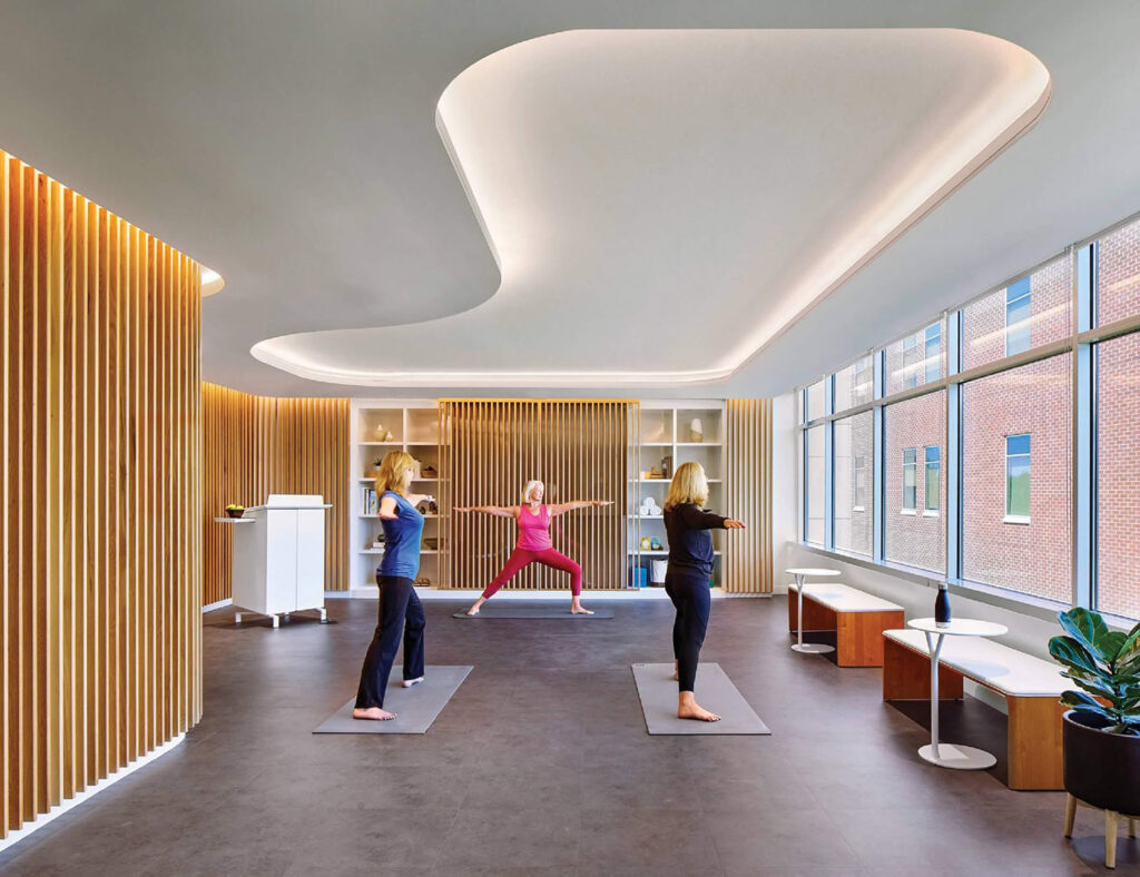 A yoga room with a woman doing yoga