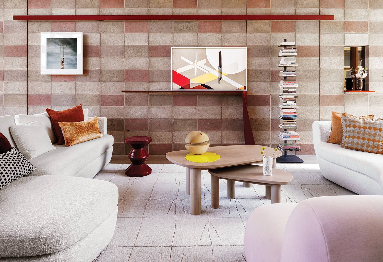 japandi interior design living room with a couch, coffee table, and a book shelf