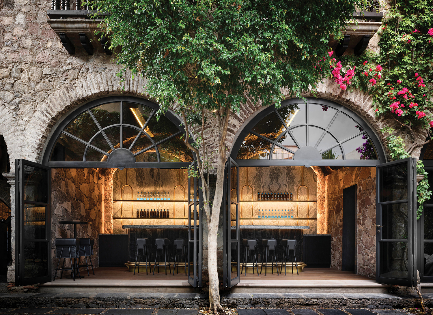 a tree in front of a building