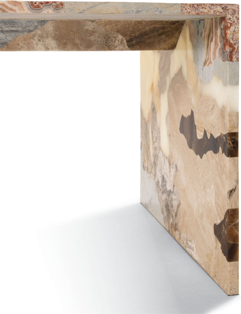 A marble console table with a brown and white marble top.