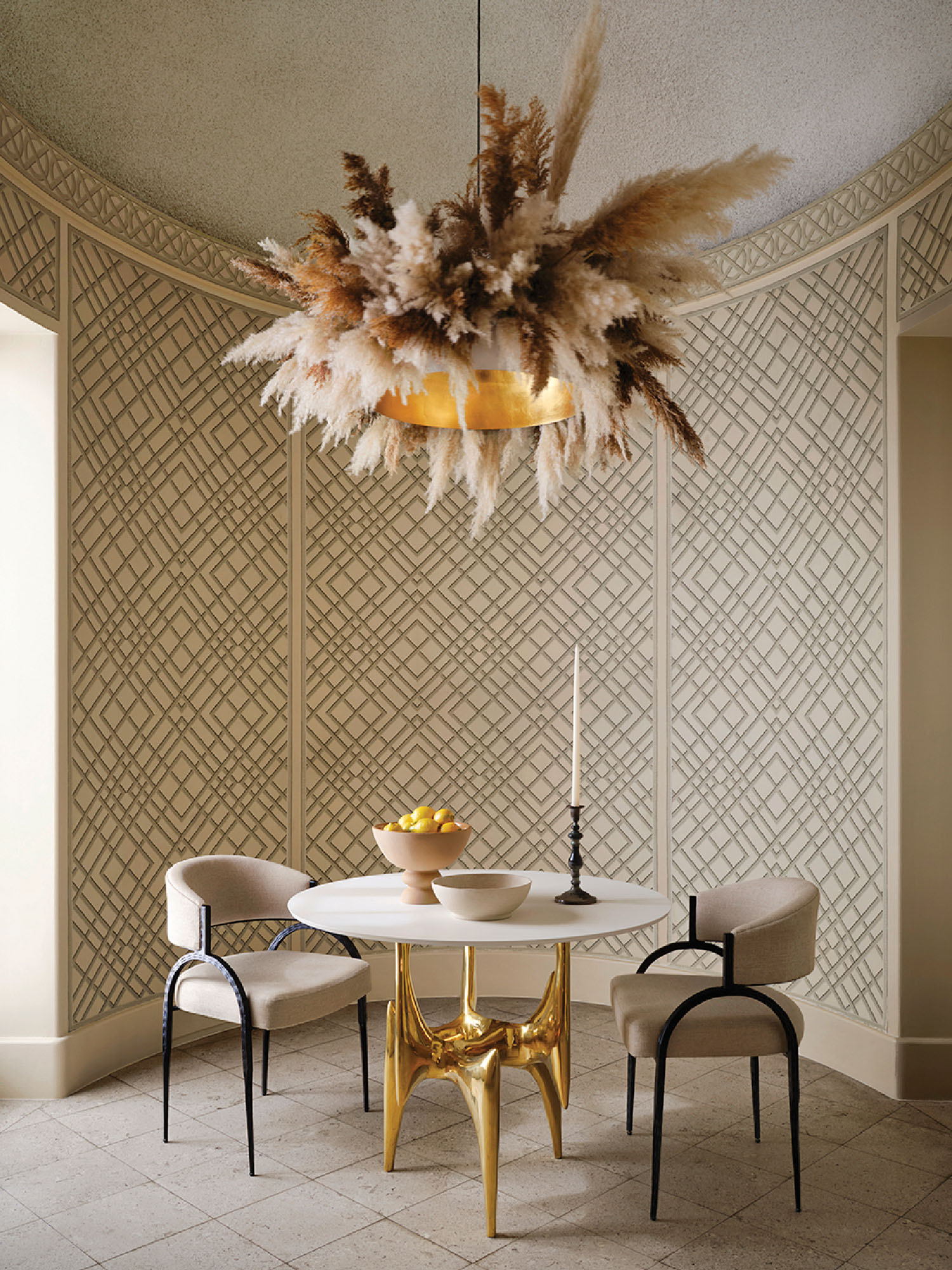 A dining room with a table and chairs.