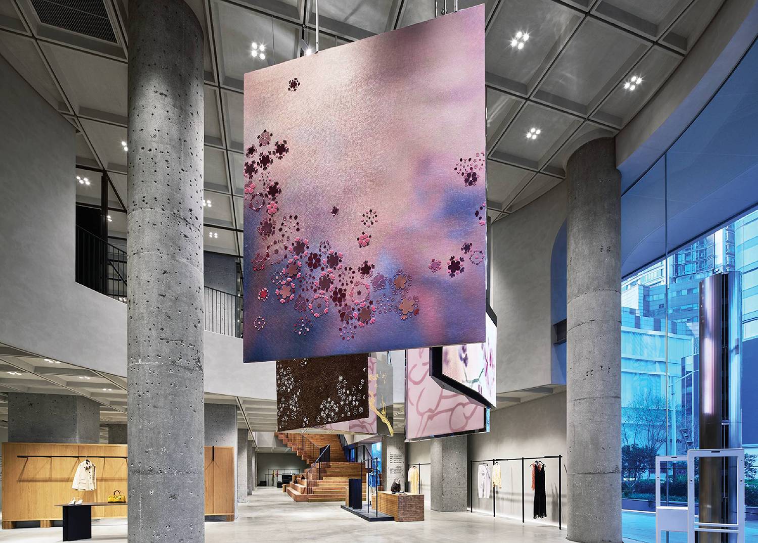 The lobby of the new building, with a large screen hanging in ZARA