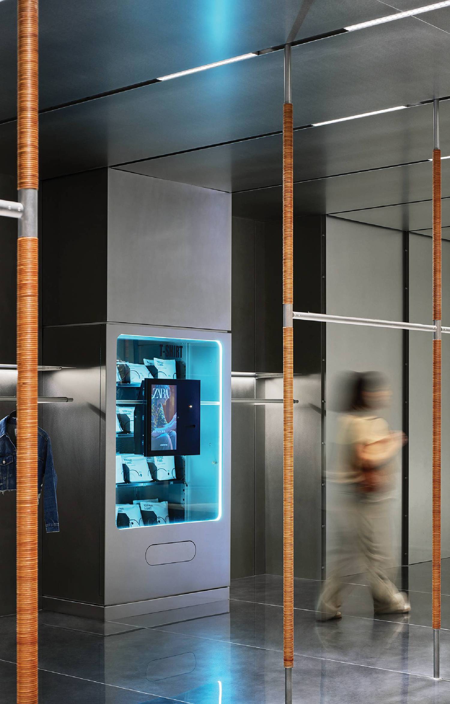 A man walking through a glass elevator