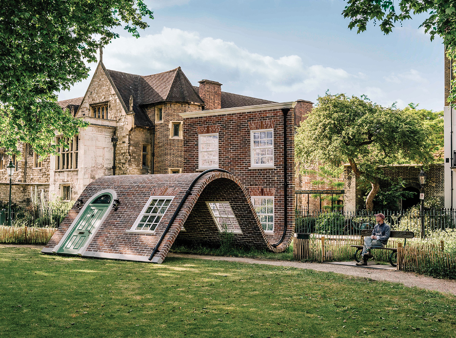 A house with a large roof and a small slide