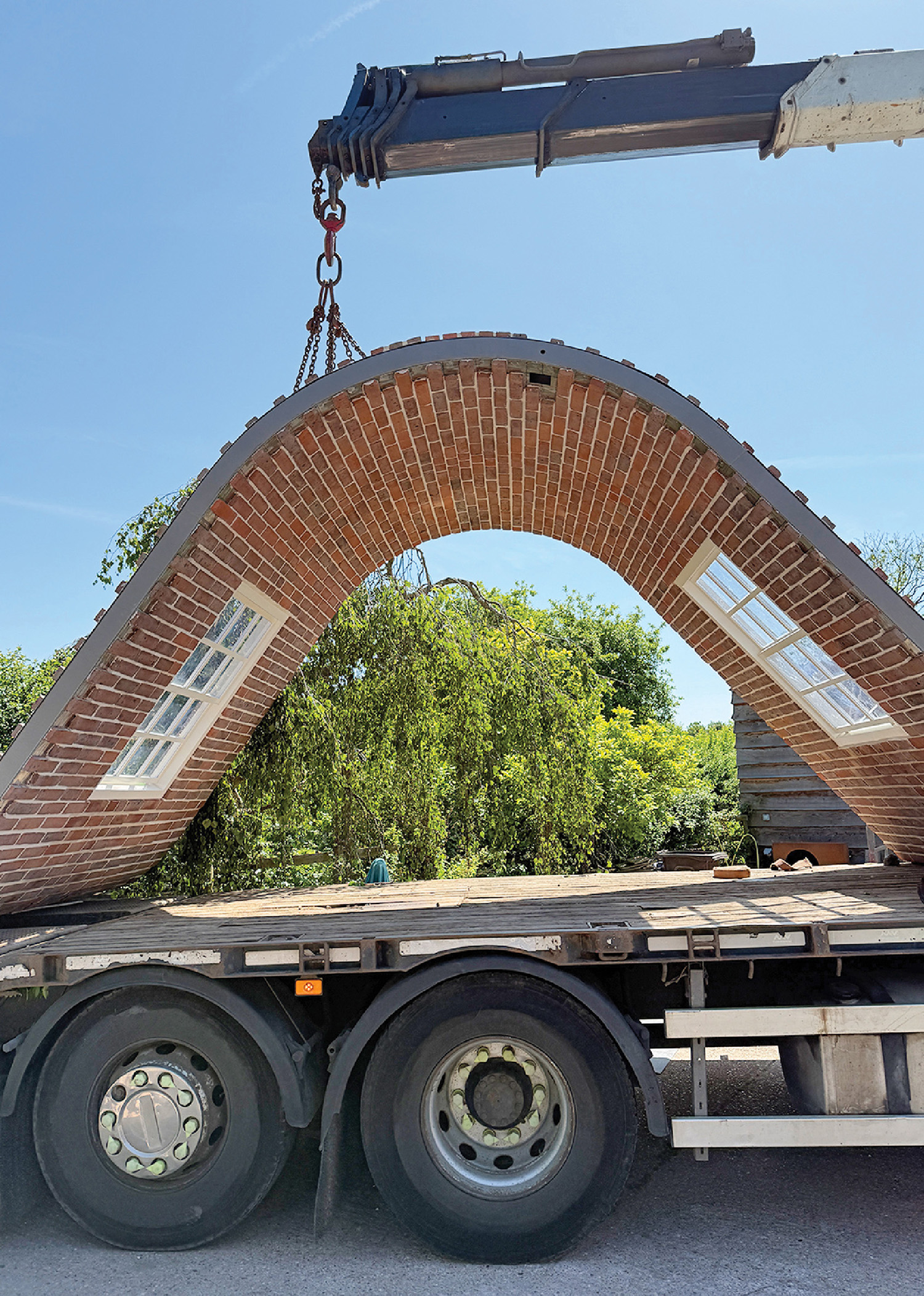 A truck with a brick arch on the back
