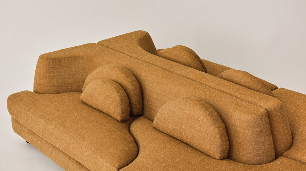 A couch with a pillow on it.