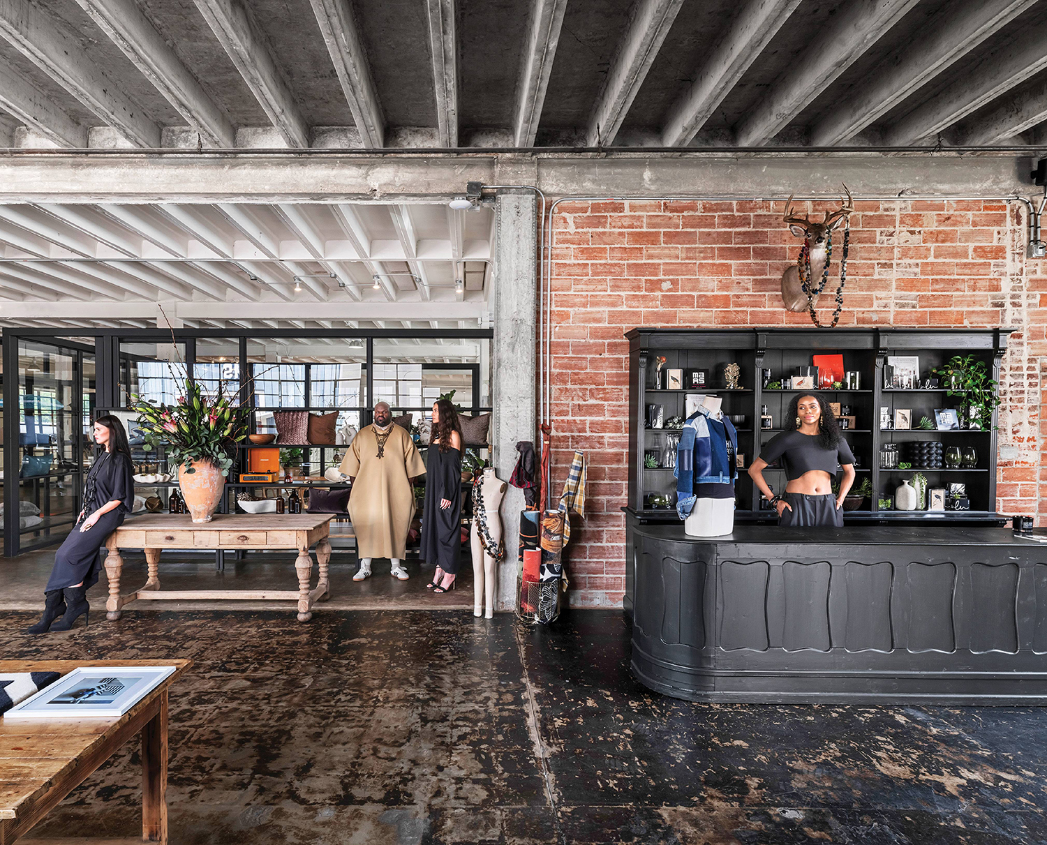 A group of people standing around a coffee shop