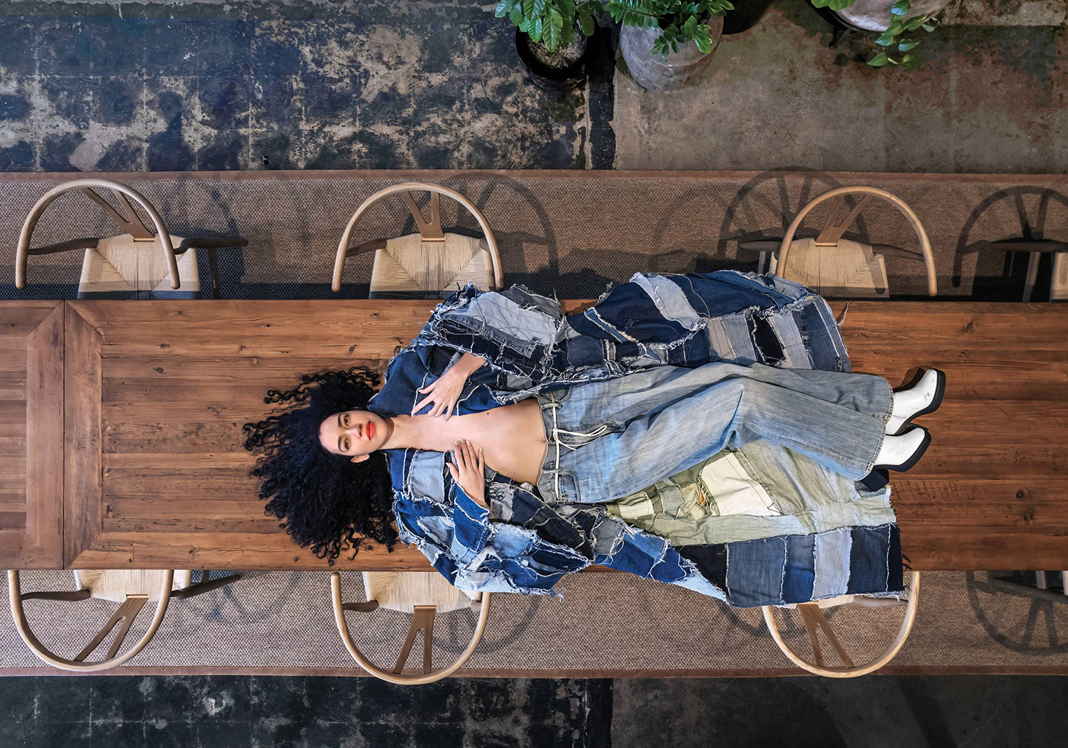 A woman laying on a bench in a room