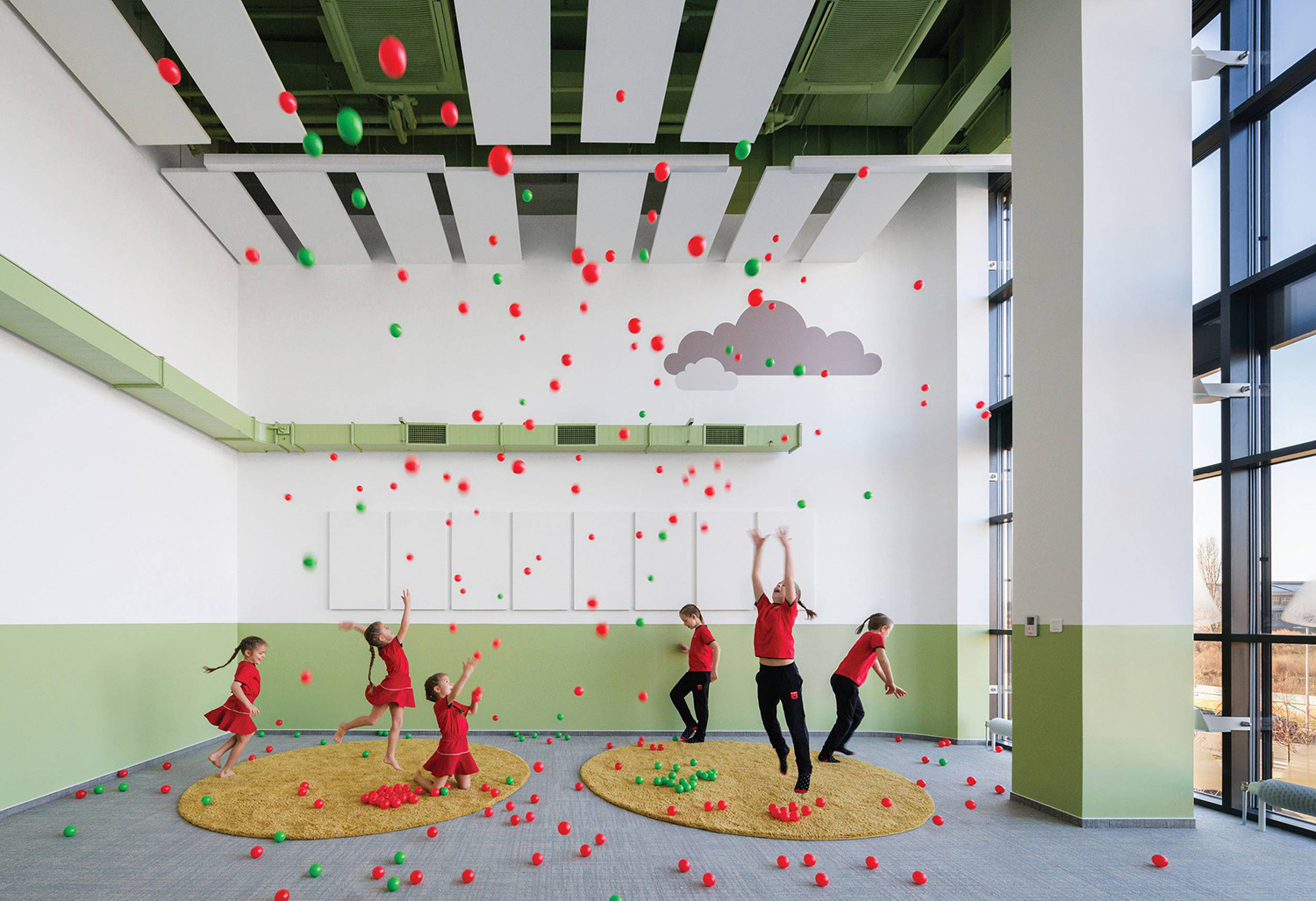 A group of people playing with balls in a room