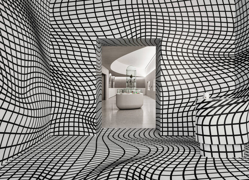 A black and white room with a large window