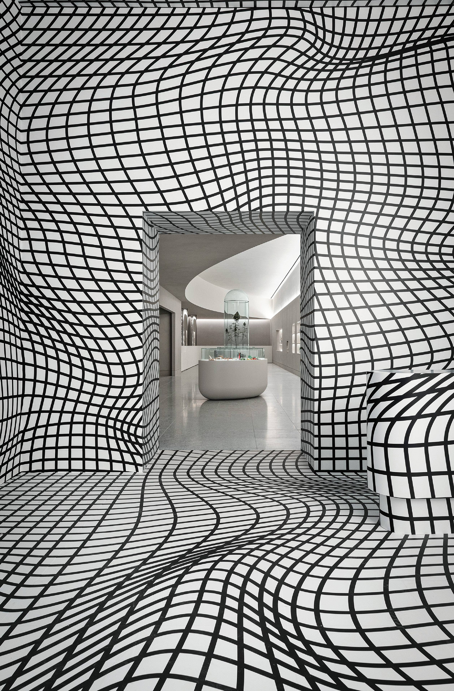 A room with a large black and white pattern on the wall