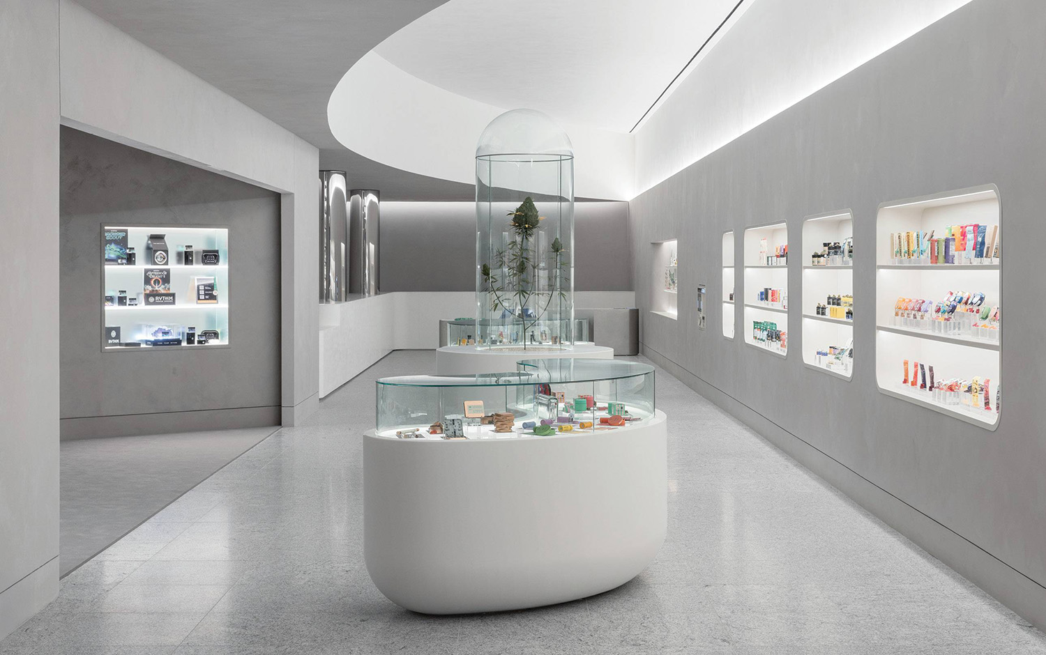 A white room with a glass display case