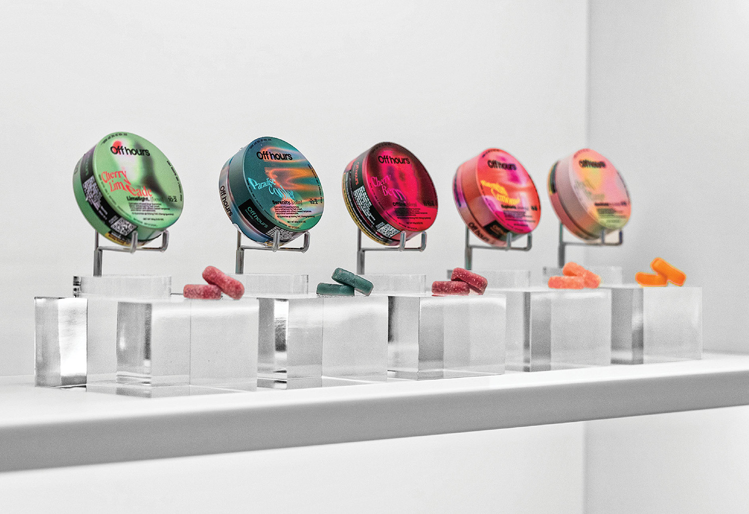A row of glass vases with different colored glass vases