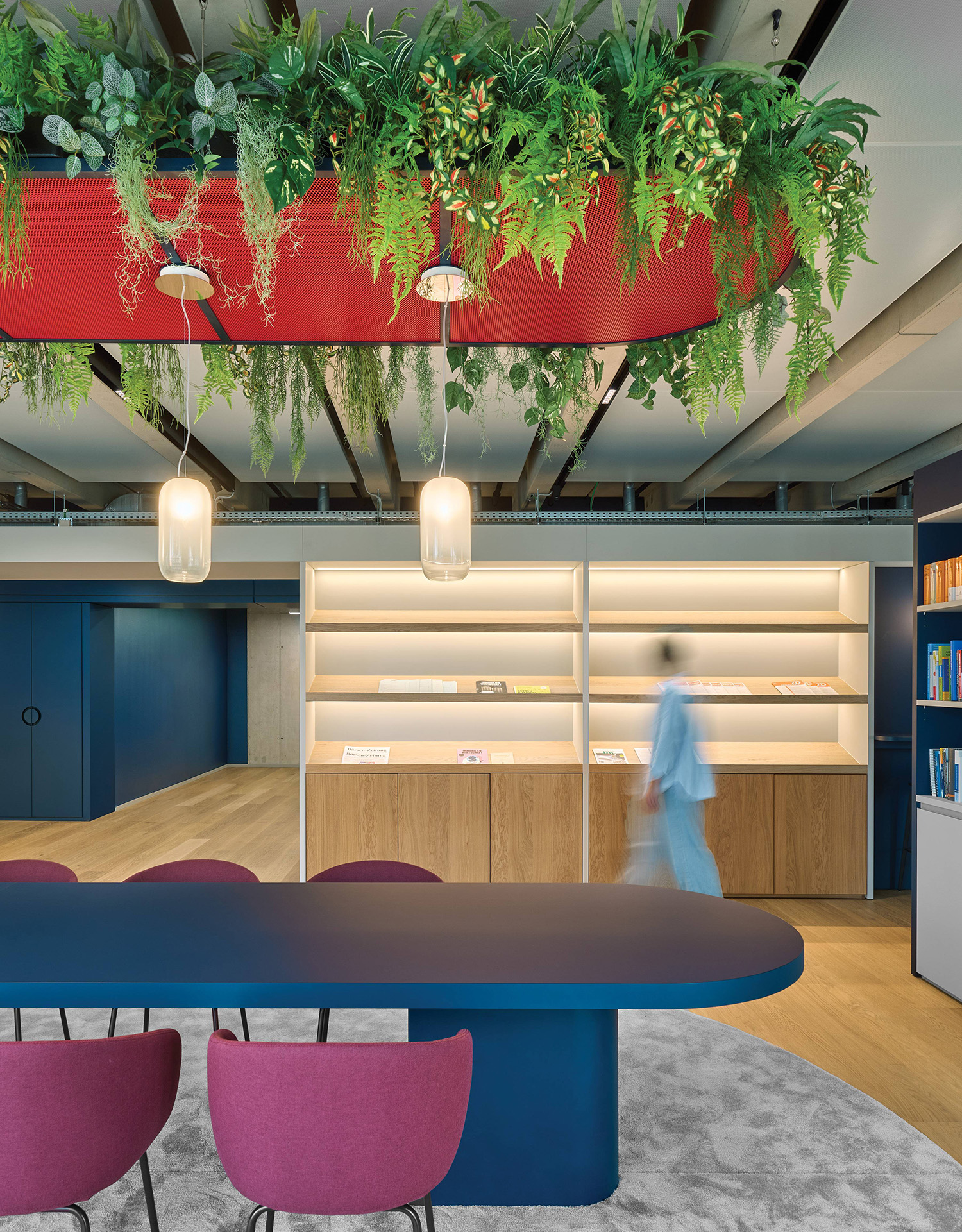 A large table with a plant hanging from the ceiling