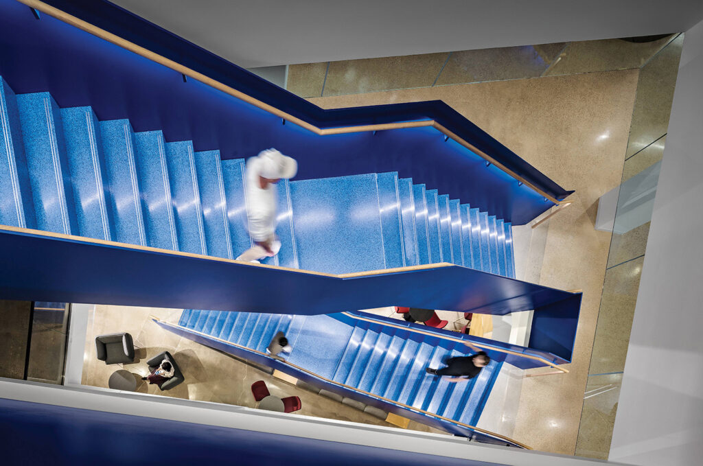 A man is walking up a set of stairs