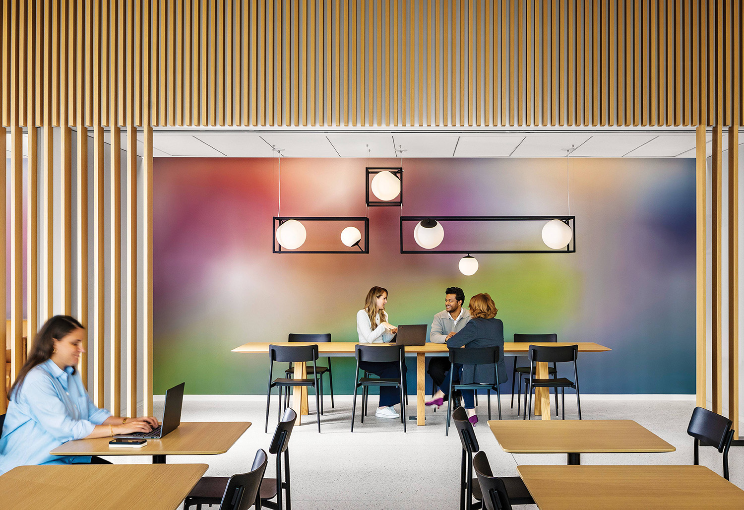 A couple of people sitting at a table in a room