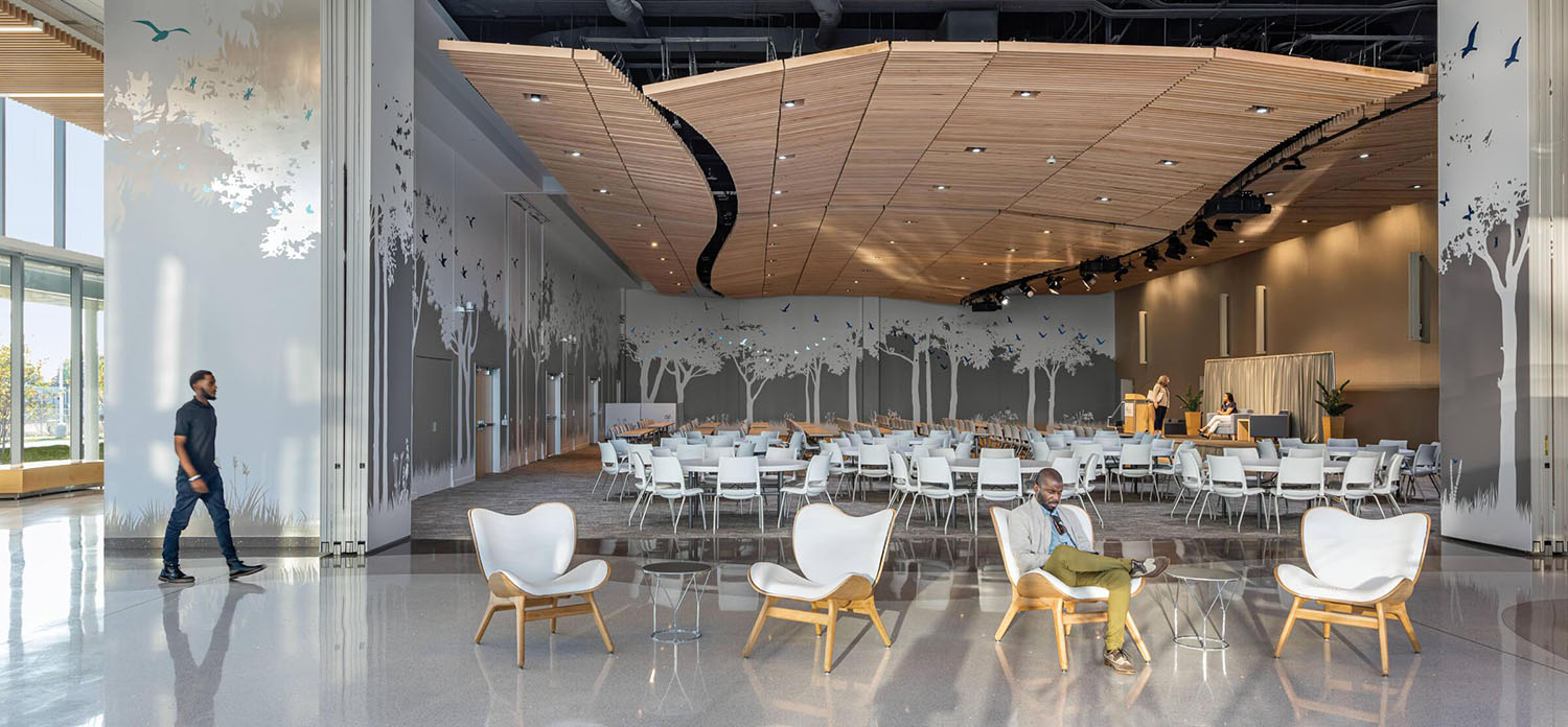 A large room with tables and chairs.
