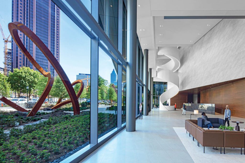 Standing on the plaza outside the building, a new structure by Pickard Chilton that consists of a pair of 10- and 17-story towers joined by a five-story podium, the sculpture is visible from the honed sandstone and natural quarried stone–floored lobby, simultaneously echoing and juxtaposing the Corian stair.
