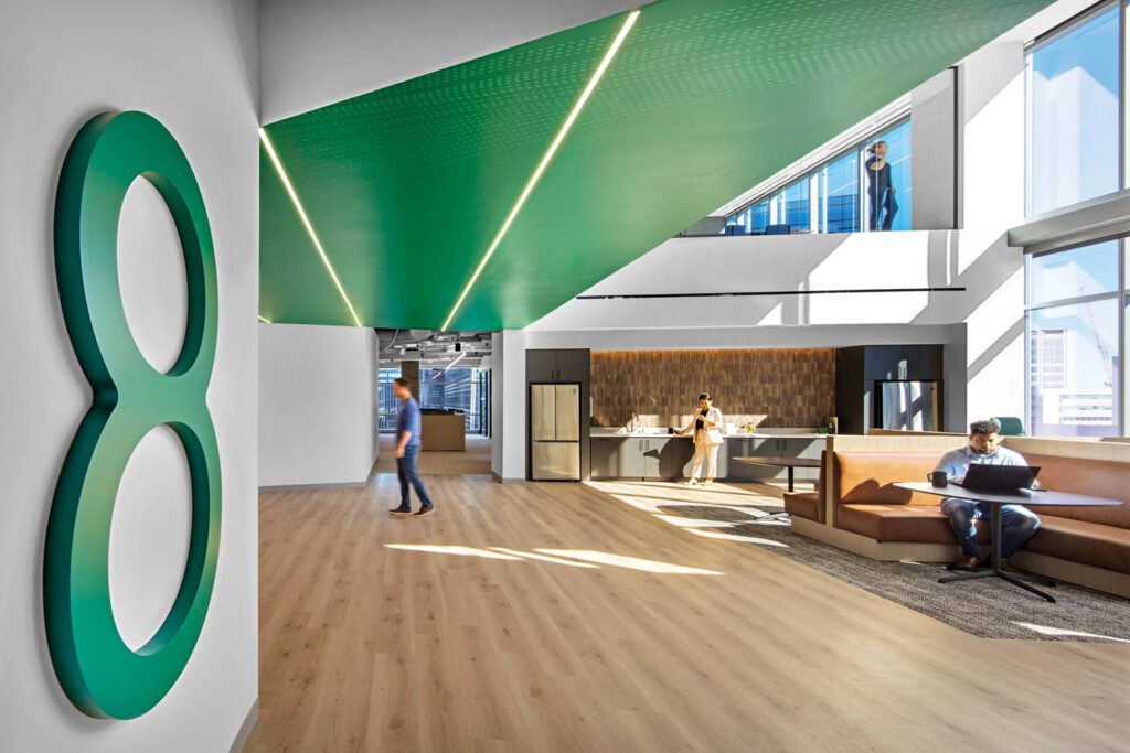Every two office floors share a double-height break room, furnished with LVT flooring, Jehs + Laub tables, and custom banquettes.