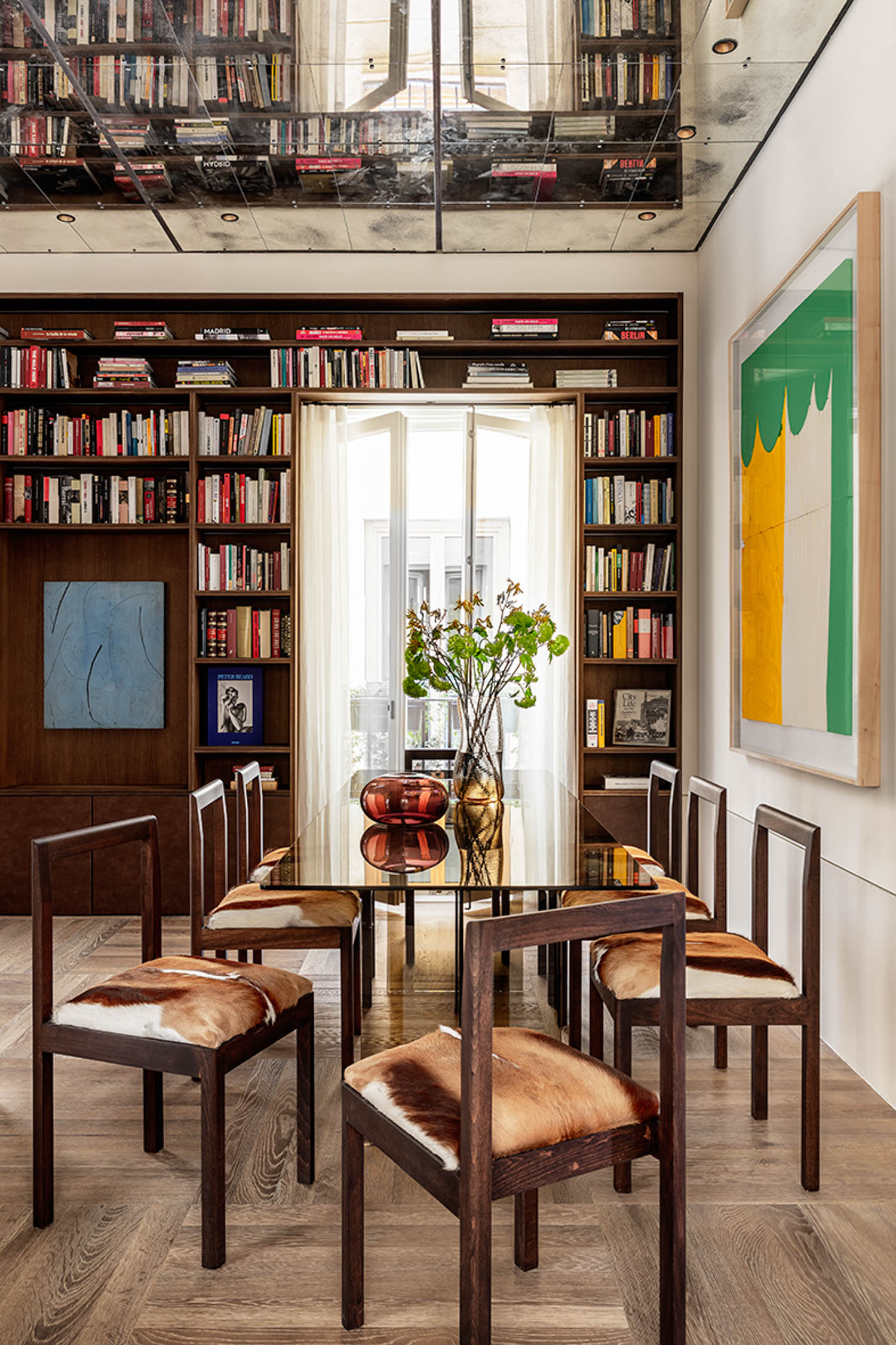 oak library shelving with mirrored ceiling