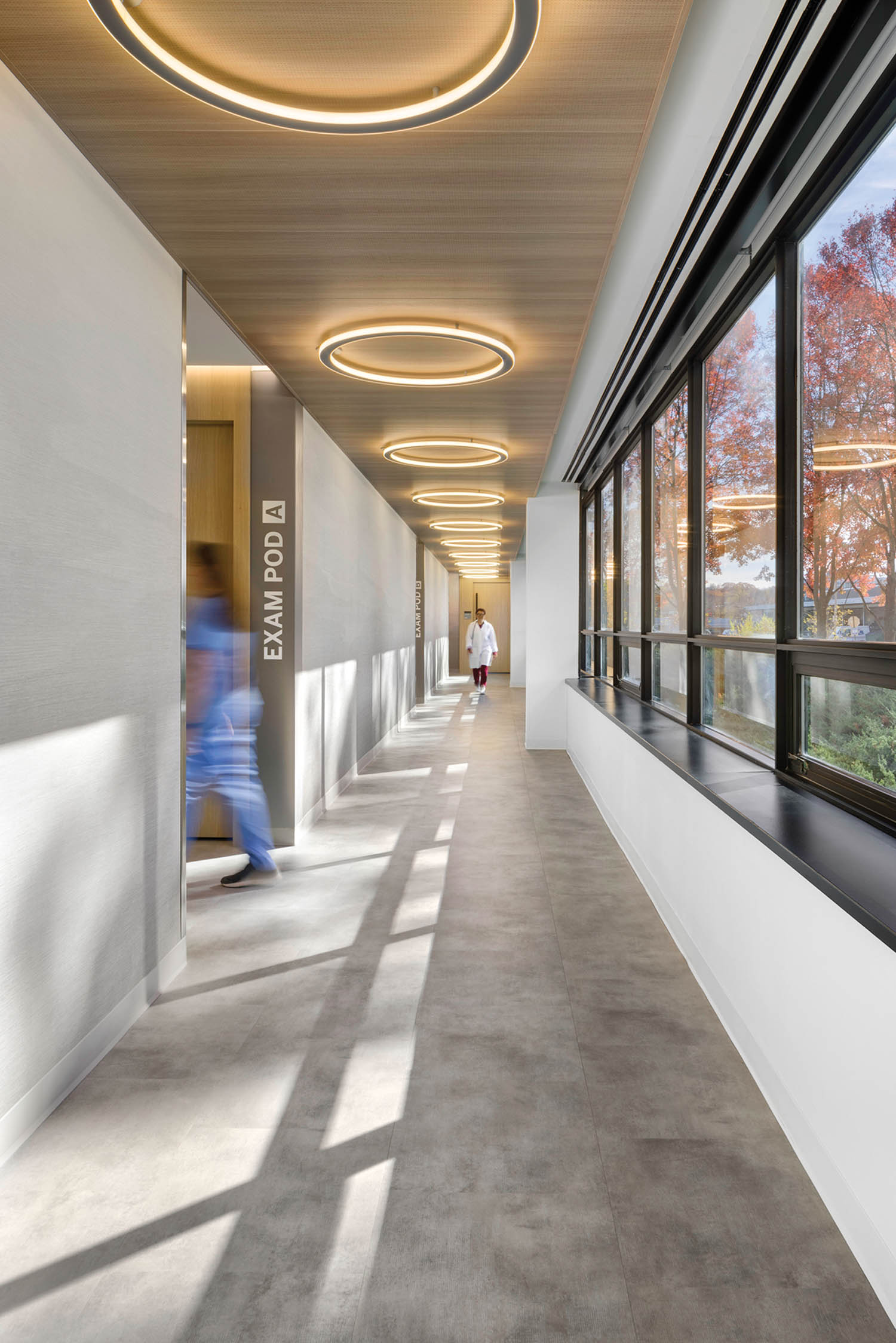 person walking through patient rooms
