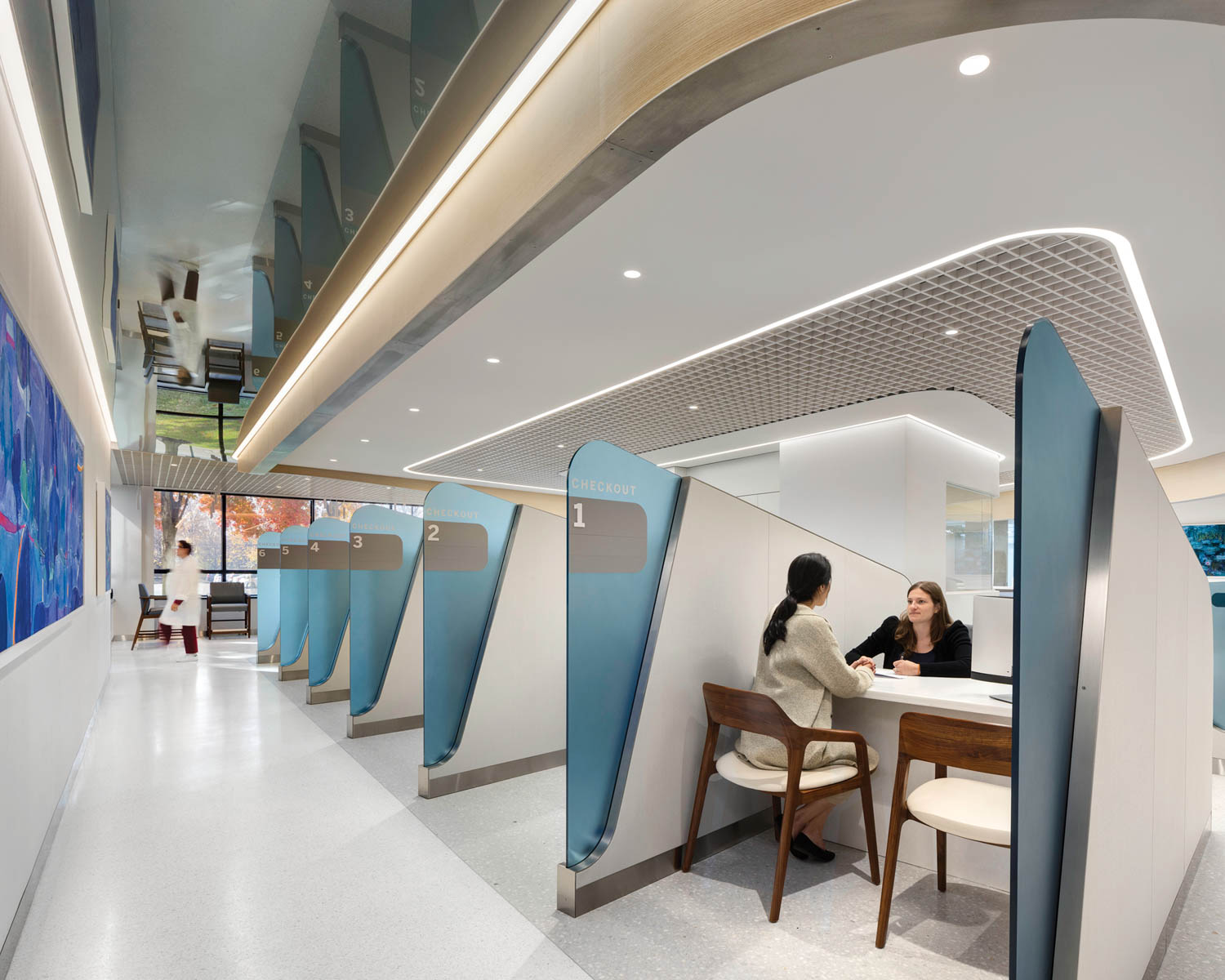 patient sitting at lobby with resin screens