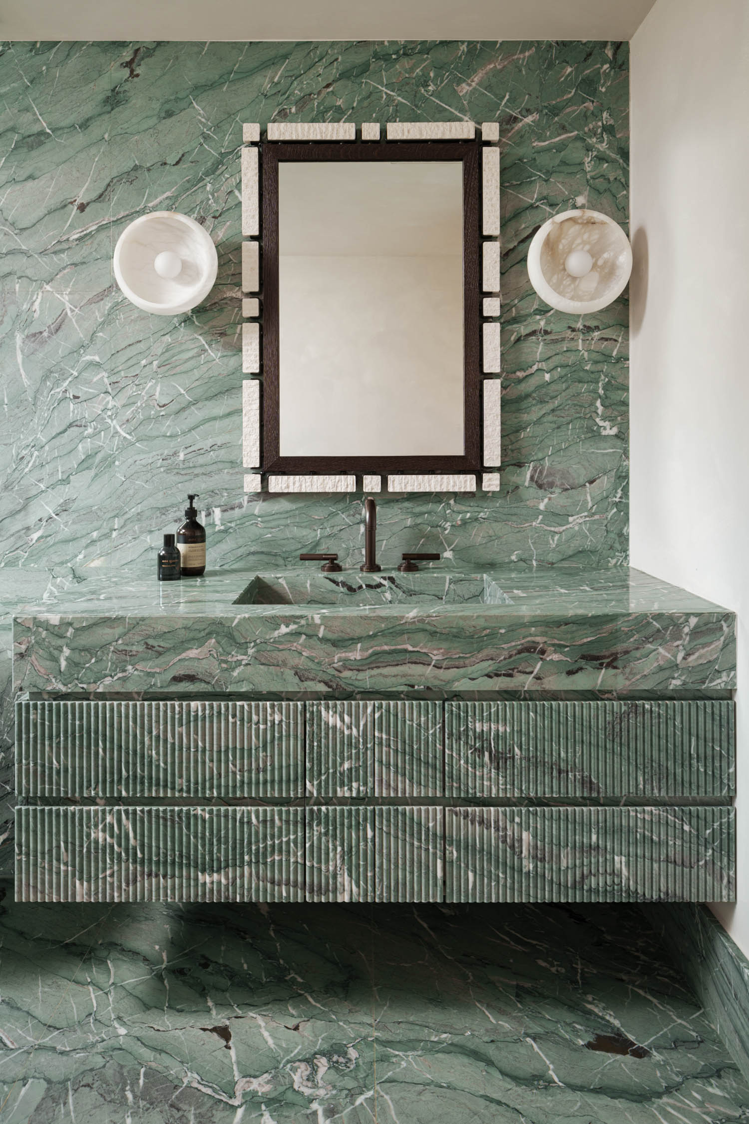 powder room in all green marble