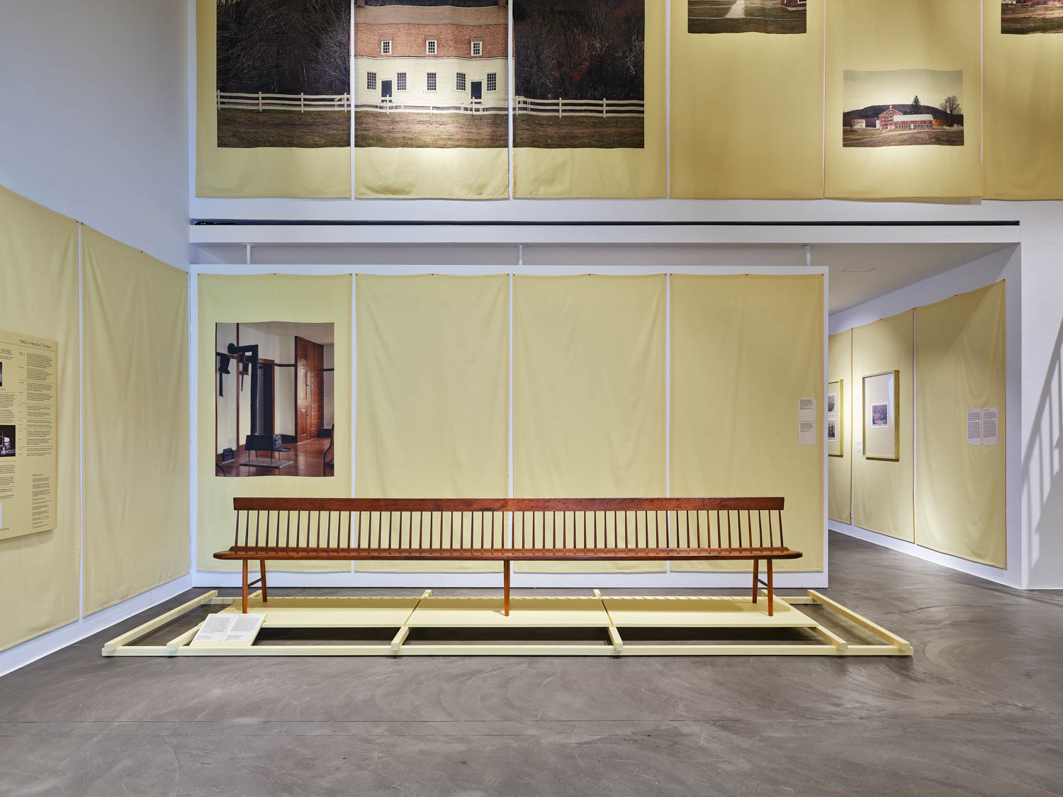 yellow room with a shaker style bench displayed