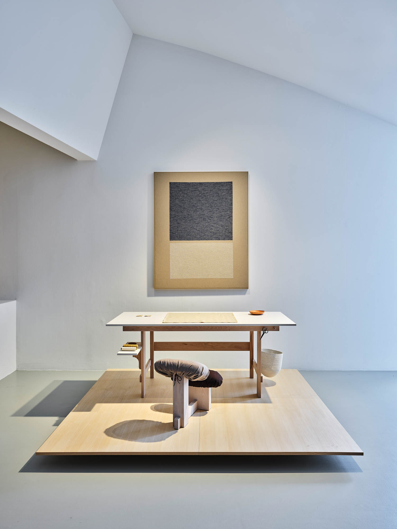 desk and a prayer room on top of a platform