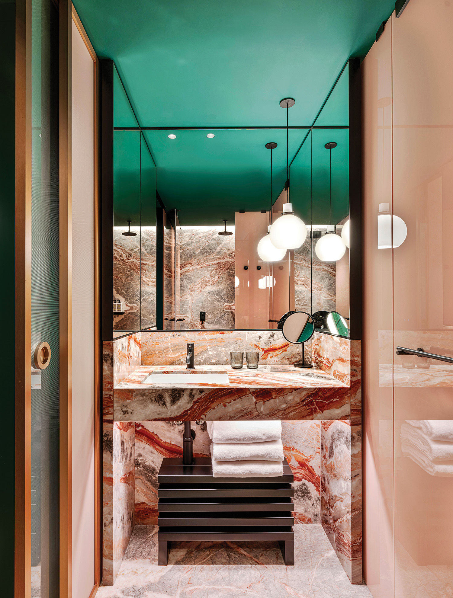 A bathroom with a marble floor and a green ceiling.